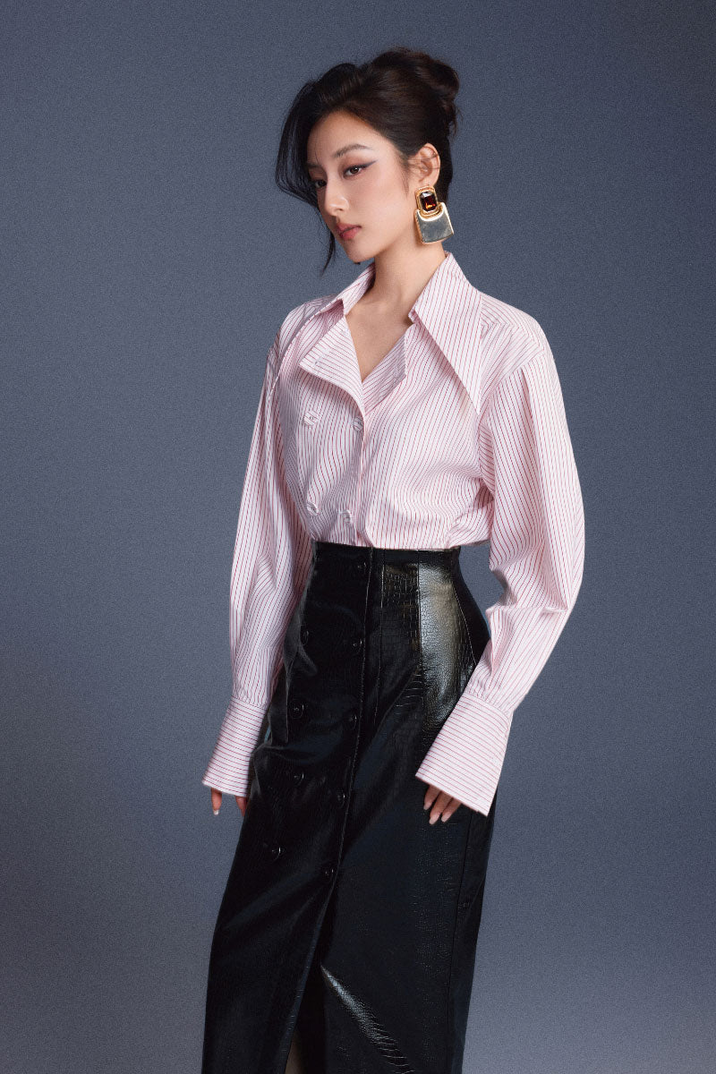 Black leather sculpted midi skirt by Keira Tong with a fitted, structured design and sleek finish.