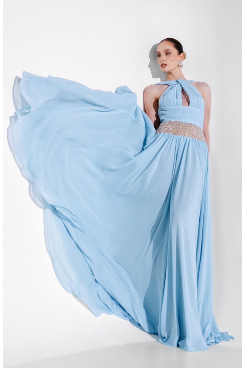 Blue embellished chiffon gown by Monika Dimova featuring intricate beadwork and flowing fabric for elegant evening wear.