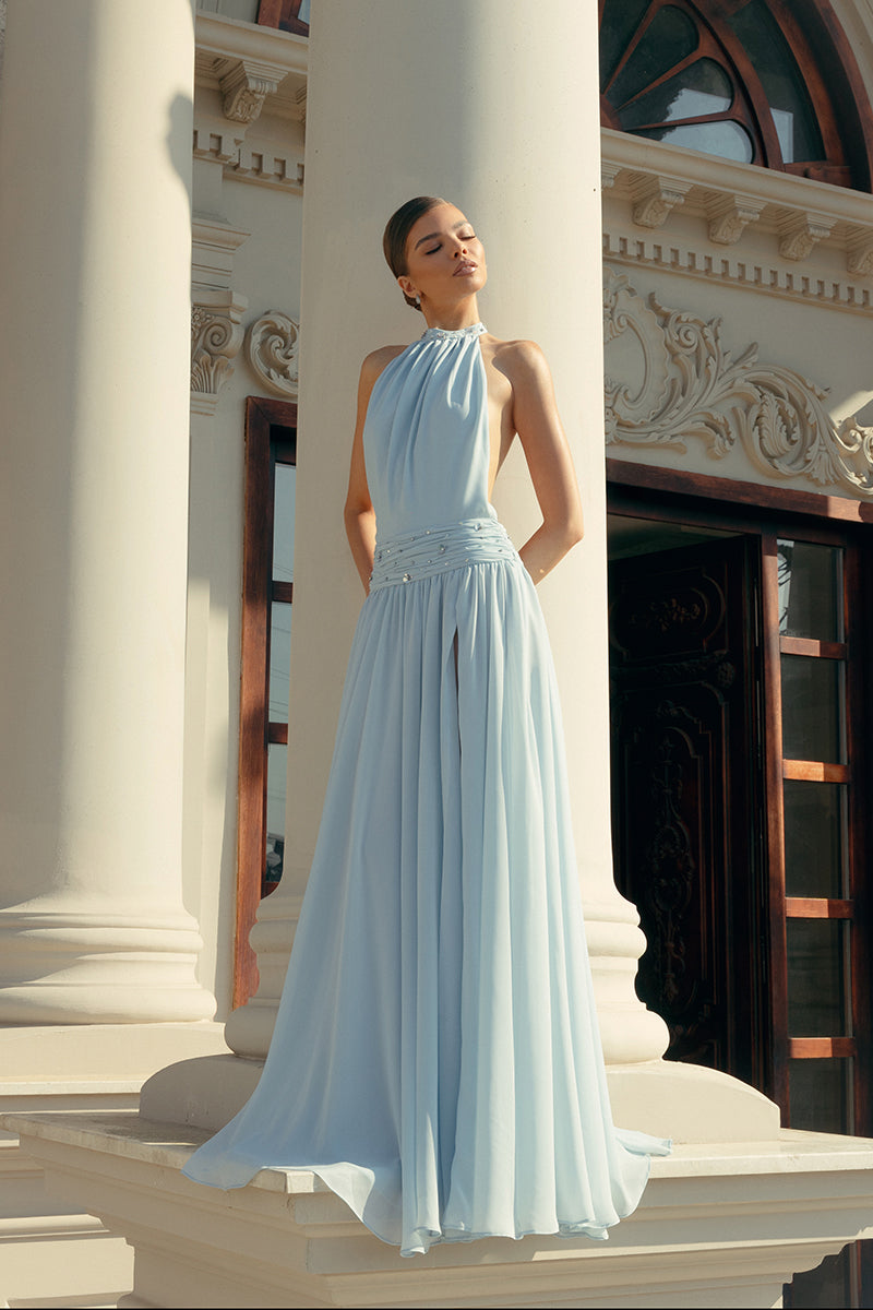 Powder blue embroidered gown by Monika Dimova, featuring intricate embroidery and flowing fabric, perfect for elegant occasions.