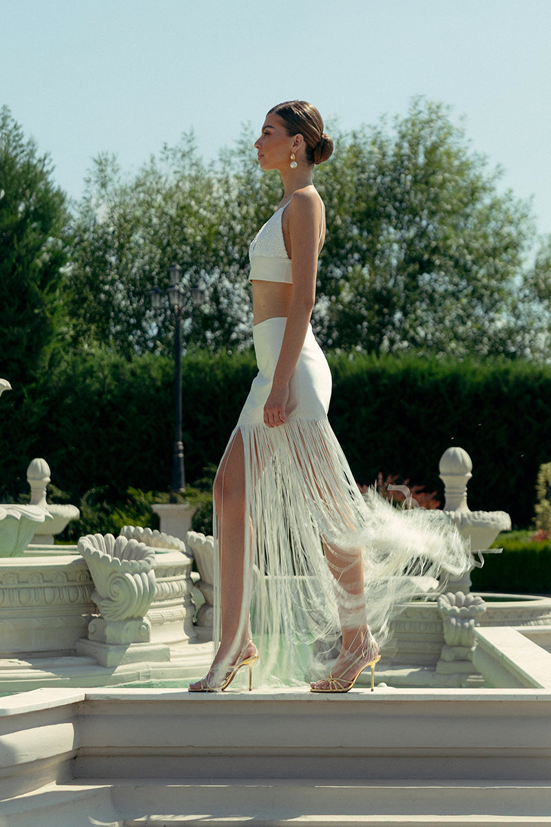 Ivory fringe two-piece co-ords set by Monika Dimova featuring a stylish top and matching skirt with fringe detailing.