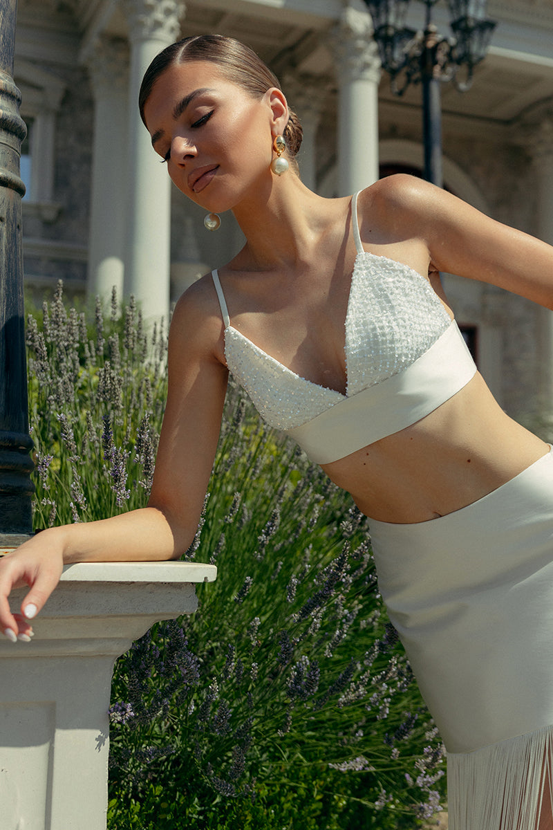 Ivory fringe two-piece co-ord set by Monika Dimova, featuring a stylish top and matching skirt with fringe details.