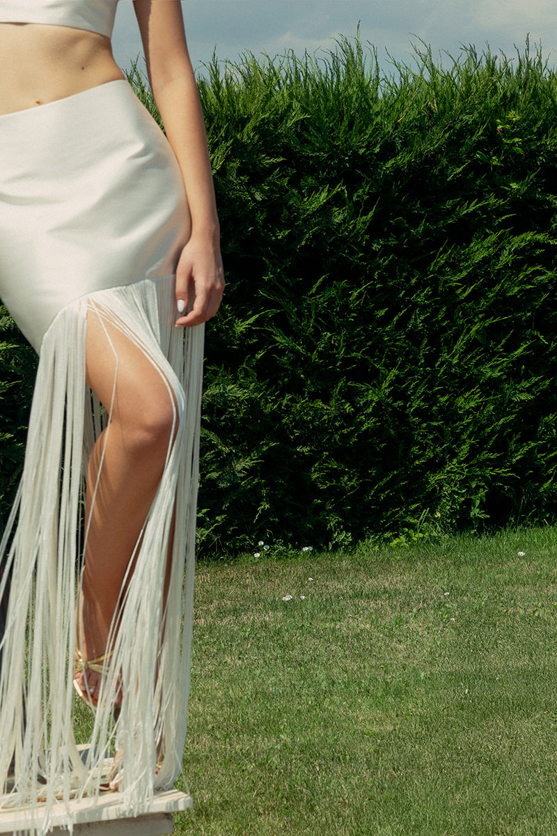Ivory fringe two-piece co-ords set by Monika Dimova, featuring a stylish top and matching skirt with fringe detailing.