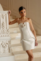 Ivory satin corset mini dress by Monika Dimova, featuring a fitted bodice and stylish mini length, displayed on a mannequin.