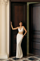 White soft crepe maxi skirt by Monika Dimova, flowing length and elegant design, shown on a model.