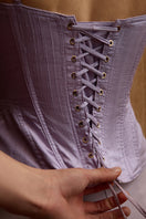 Purple candy corset top by IKINITA with lace-up detail and structured fit, styled for a bold fashion statement.