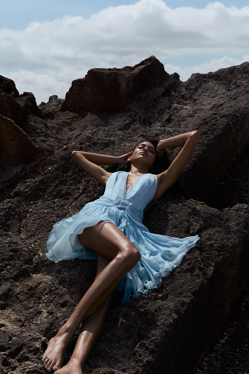 IKINITA La Biana in Blue mini dress displayed on a model with flowing fabric and stylish design, perfect for casual or dressy occasions.