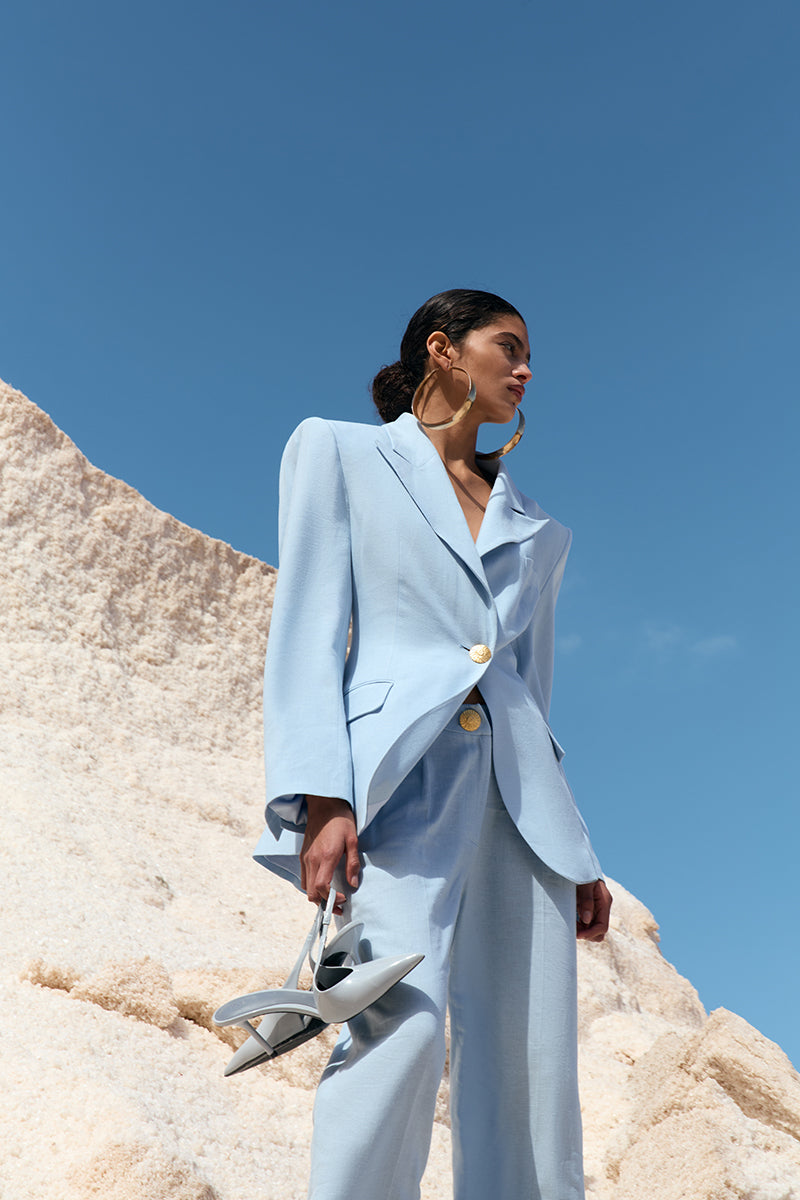 Blue THE SUN jacket by IKINITA, lightweight jacket with a stylish design, shown in a close-up image.