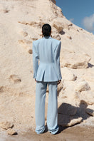 IKINITA THE SUN PANTS in blue, casual pants with a relaxed fit, shown on a model against a neutral background.