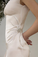 White IKINITA sundress, mini dress style, featuring lightweight fabric and a flowy silhouette perfect for warm weather.