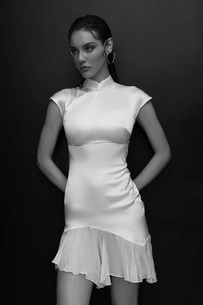 White IKINITA sundress, a stylish mini dress with a flowy design, perfect for casual and summer wear.
