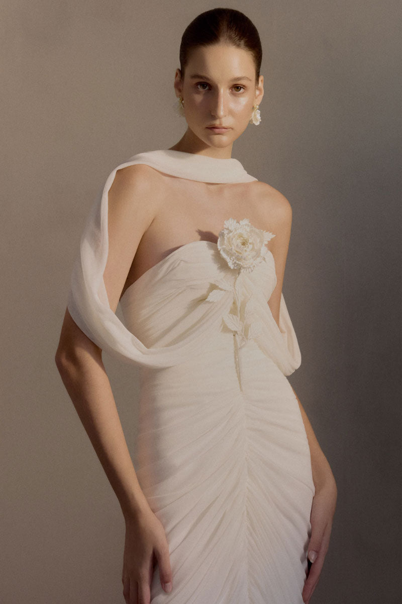 White Plan Sedley dress gown featuring a flowing design with long sleeves and elegant fabric for formal occasions.