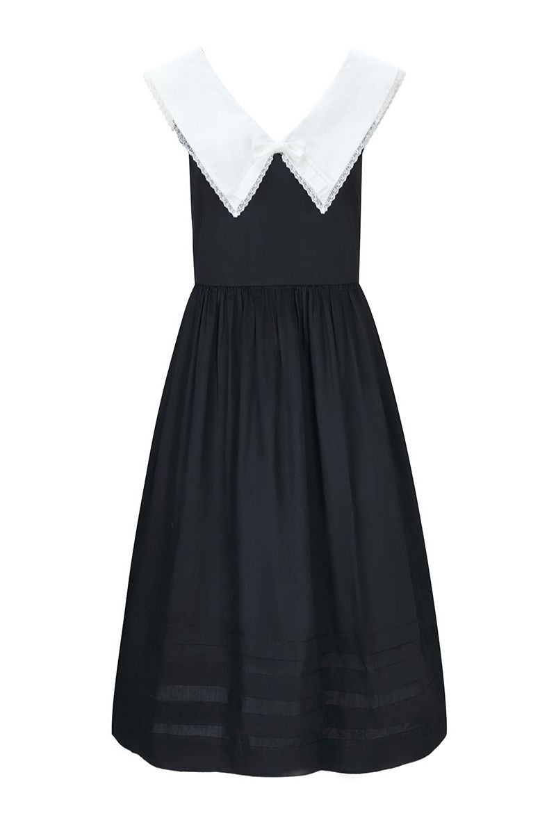 Black Sydney dress by Chictopia, elegant midi dress with a fitted silhouette, shown on a model against a neutral background.