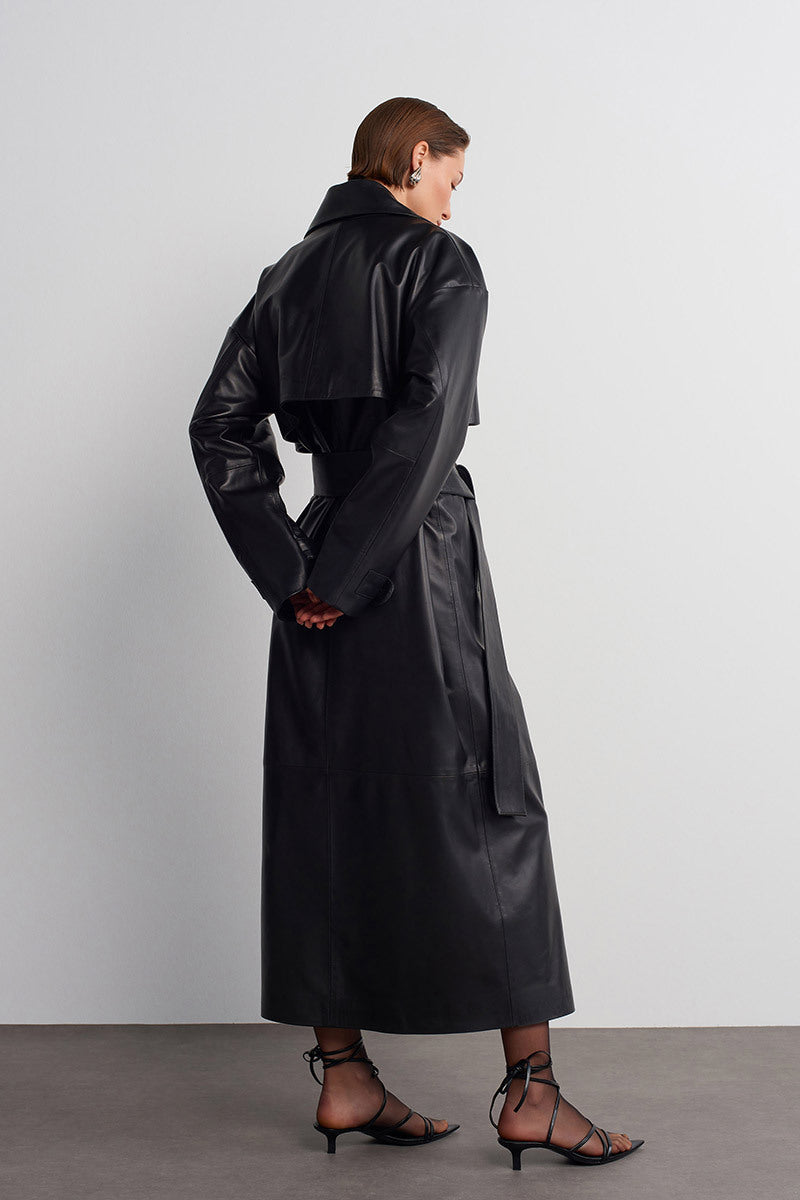 Black leather trench jacket by Acaria Studio, featuring classic design, tailored fit, and stylish lapels.