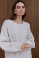 Undress Alexa cream mini sweater dress featuring a cozy knit fabric and fitted silhouette, perfect for casual or dressy occasions.