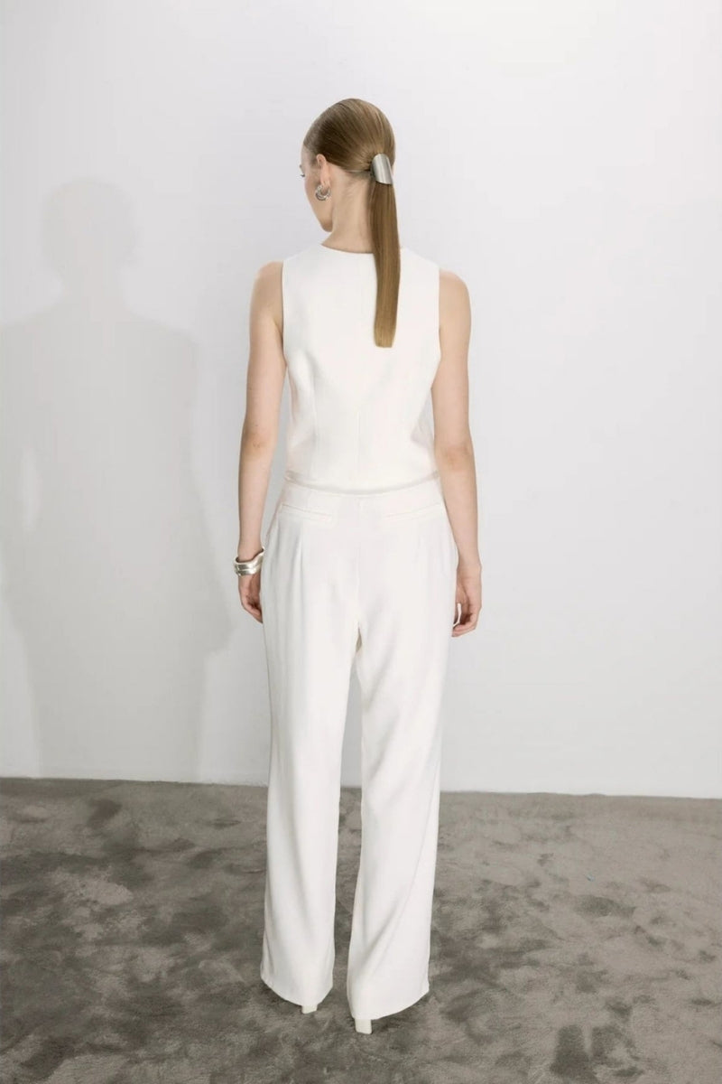 White Tina trousers by Nazlı Ceren featuring a satin waistband, tailored pants with a sleek, elegant fit.