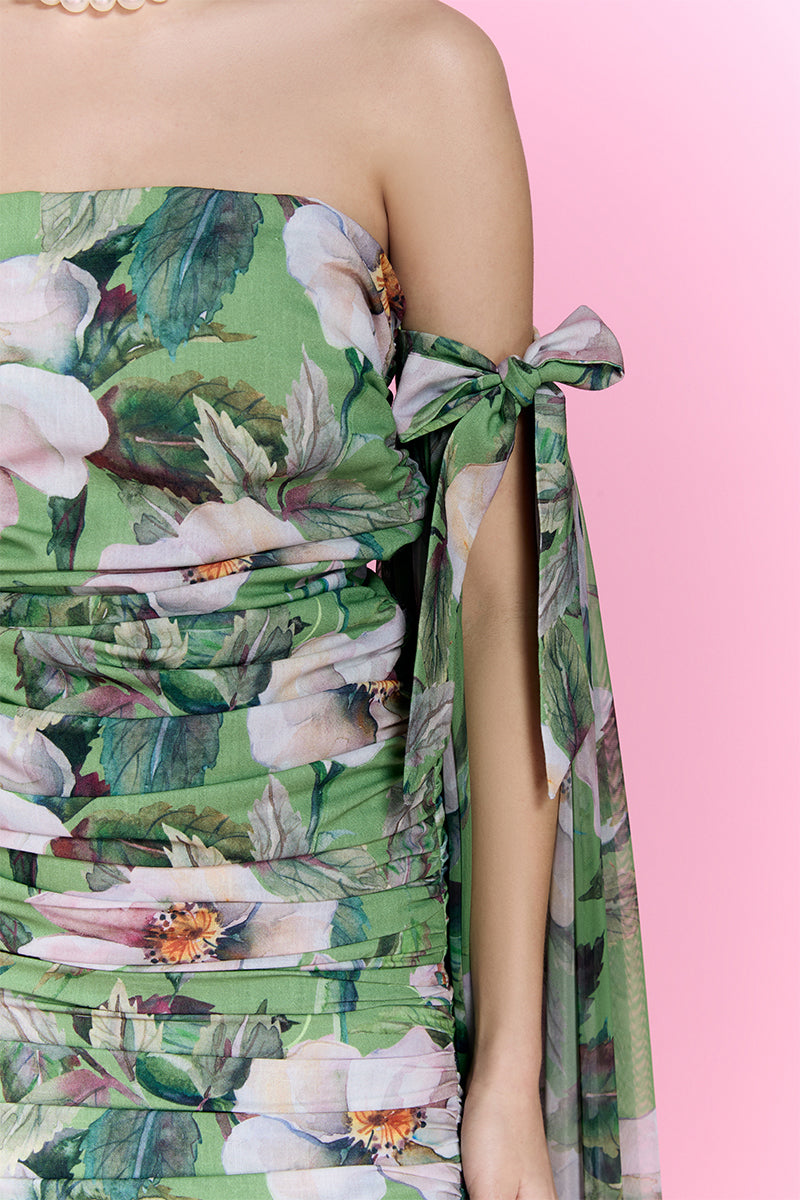 Nur Karaata Poppy Reverie mini dress with floral pattern, sleeveless design, and fitted silhouette on a model.