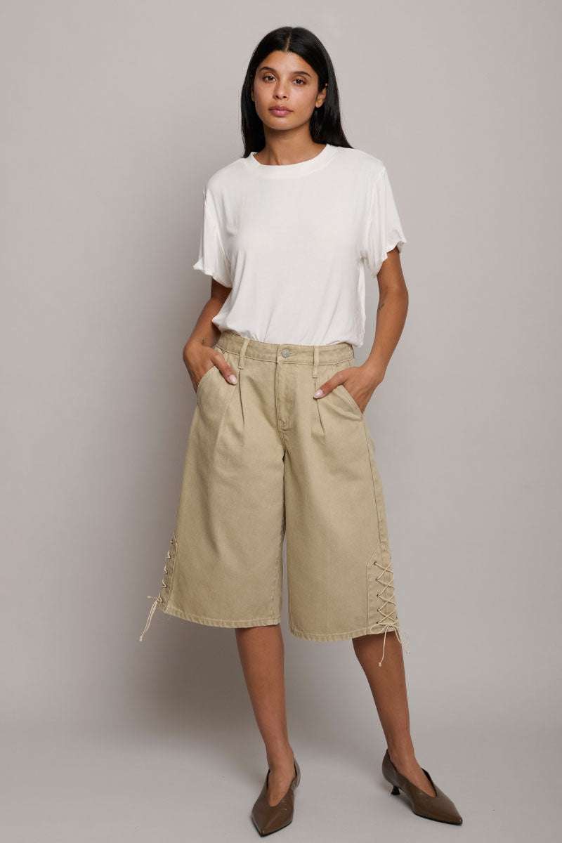 TT Studios Bobbi Shorts in Bedford Ave, casual denim shorts with distressed details and frayed hem, shown on a model.