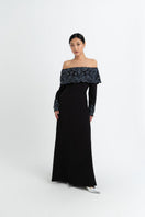 Elegant black Maria Black gown by Raishma featuring a flowing fabric and sophisticated silhouette.