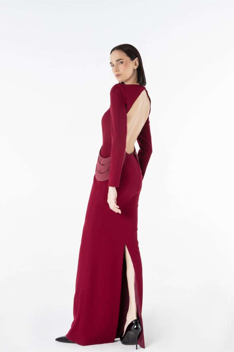 Lili Blanc crepe gown with flowing design, elegant neckline, and long sleeves, displayed on a mannequin.