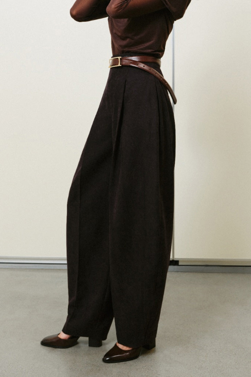 Lecia balloon trousers showing loose, oversized fit with high waist and gathered ankle cuffs in soft fabric.