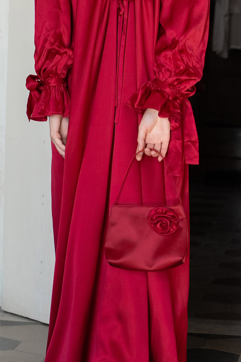 Red Tuscan Rose silk handbag with shoulder strap from Not Just Pajama, featuring elegant design and soft, luxurious fabric.