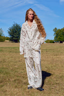 Unisex brown printed twill pajama set featuring long sleeves and matching pants, comfortable sleepwear by Not Just Pajama.