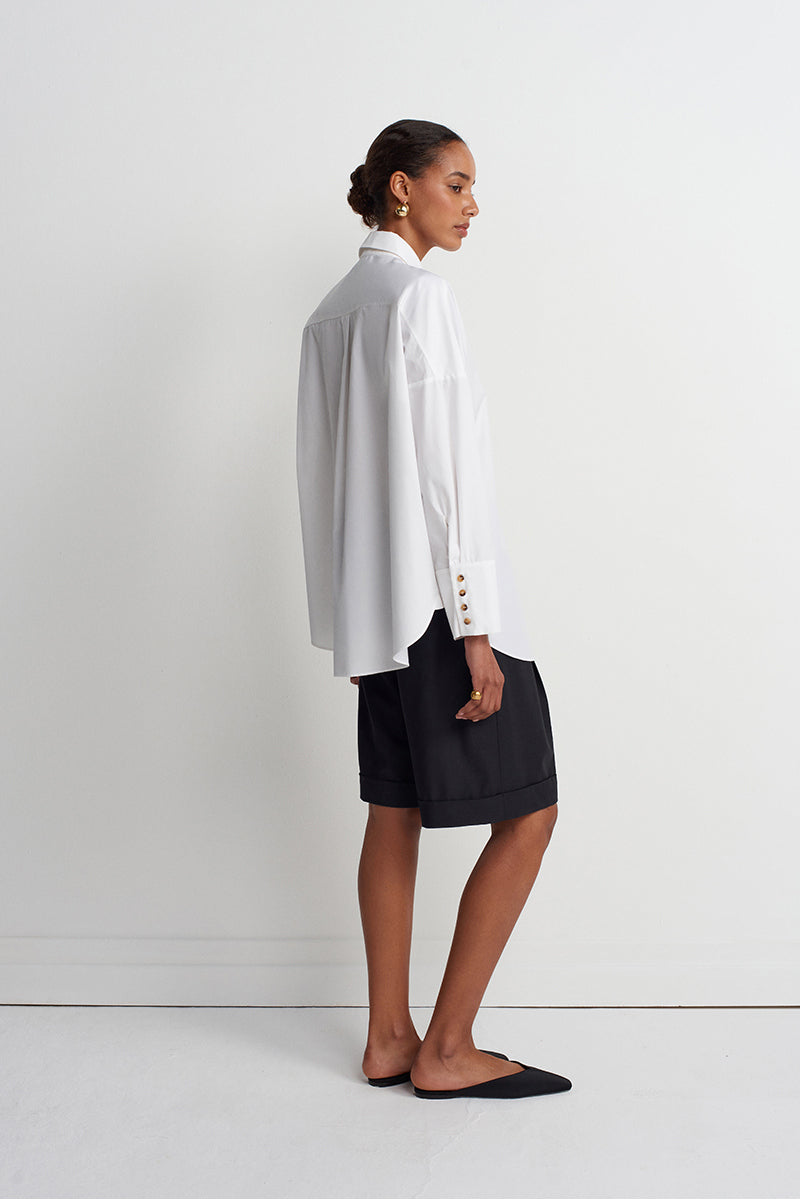 Acaria Studio iconic shirt displayed flat, showcasing the stylish design and fabric details of the men's shirt.