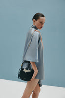 Black Maria mini top handle bag by Vikele Studio with a sleek, compact design and minimalist style.