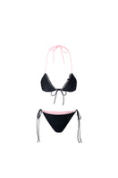 Reversible pink and black bikini set by Suncillo, featuring halter top and matching bottoms on a flat lay.
