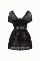 Black Bianca lace mini dress by 21Six, featuring delicate lace fabric and a fitted silhouette, shown on a model.
