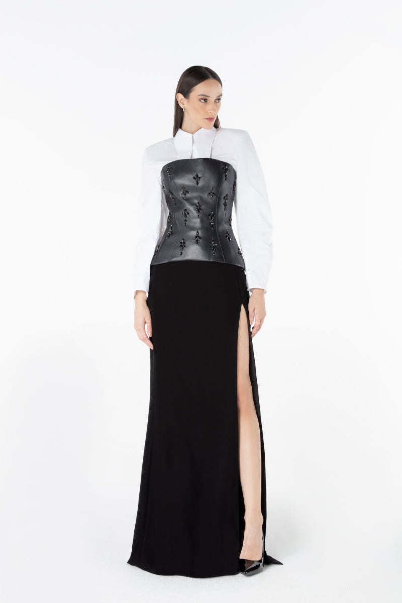 Lili Blanc Meridian Contour Maxi Skirt in flowy fabric with a fitted waist and elegant silhouette.