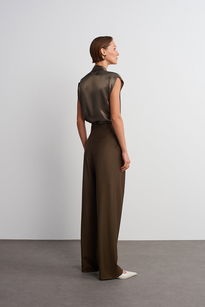 Dark brown Earth Pants by Acaria Studio, showing relaxed fit and earthy fabric texture on a neutral background.