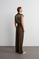 Dark brown Earth Pants by Acaria Studio, showing relaxed fit and earthy fabric texture on a neutral background.