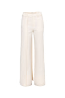 SÉLONE Calin Overlay Trousers in Soft Ivory, stylish pants with layered design and relaxed fit, shown in a natural fabric appearance.