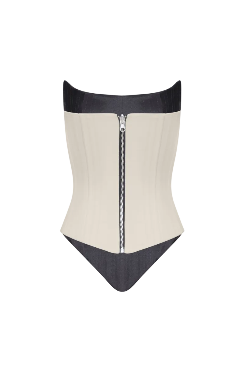 Angled two-sided corset top by BALYKINA featuring a structured design with adjustable straps and a sleek black finish.