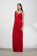 Deme By Gabriella Adriana Red Maxi Dress displayed on a hanger with flowing fabric and elegant design.