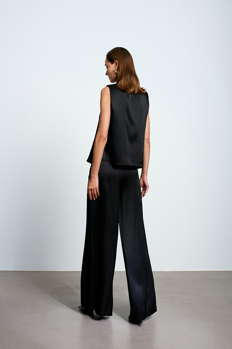 Black satin top by Acaria Studio, featuring a stylish and sleek design, perfect for trendy tops and elegant casual wear.