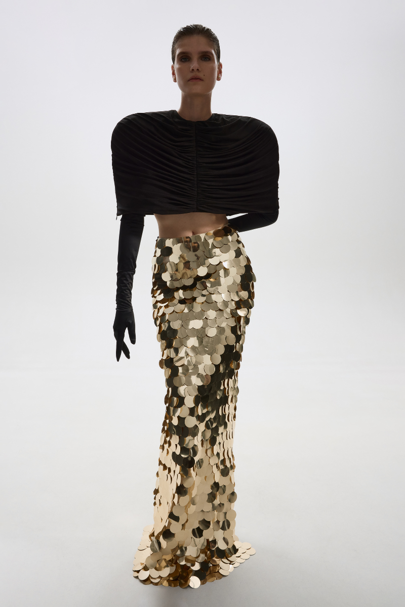 Gold sequined maxi skirt by Balykina featuring a flowing design and shimmering embellishments for elegant style.