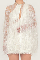 Embroidered feather cape jacket by Monika Dimova featuring intricate embroidery and a flowing, stylish design.