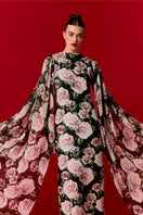 Nur Karaata Marianne maxi dress, long flowing dress with floral patterns, sleeveless design, and elegant silhouette.