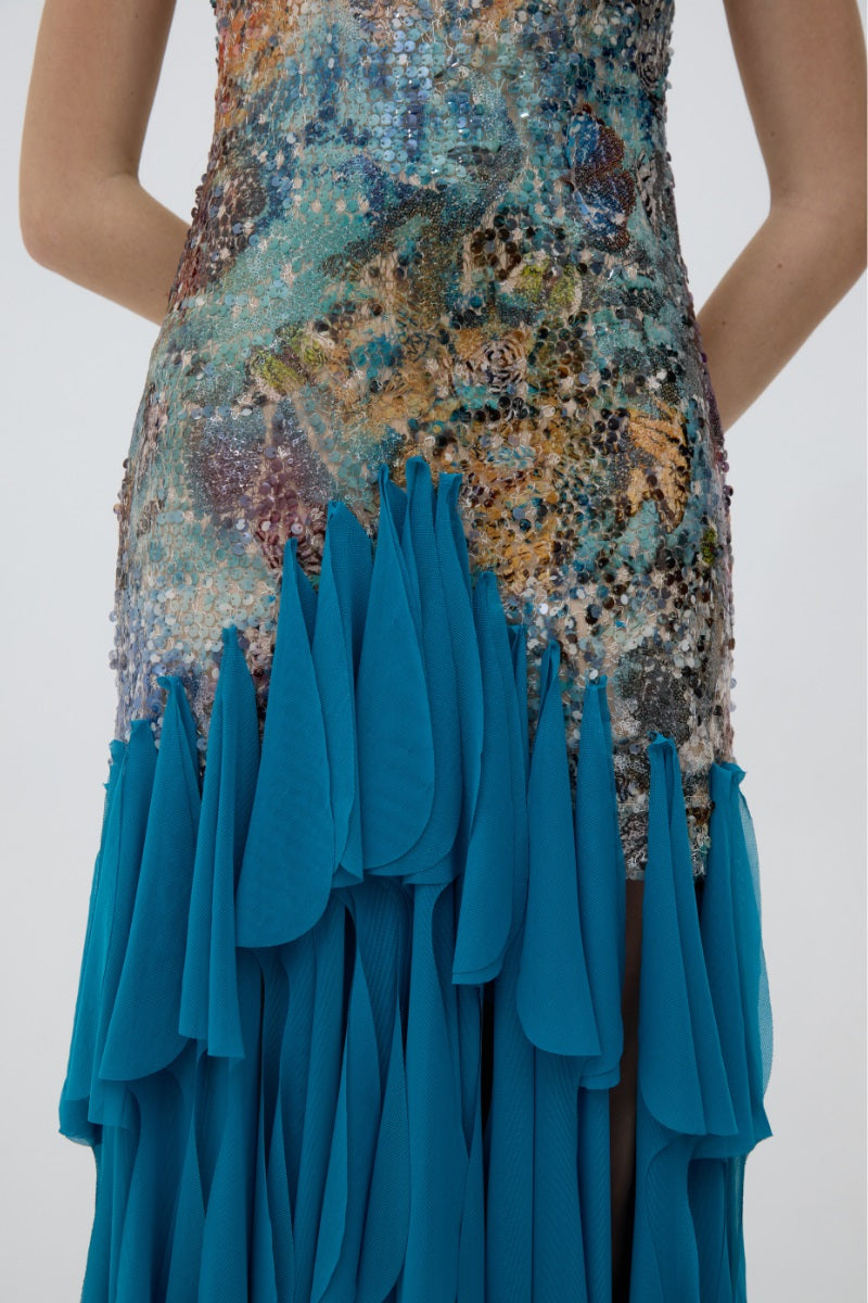 Kontenta Marina Party Dress in Netuno Blue, elegant maxi dress with flowing fabric and detailed design, perfect for special occasions.