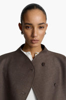 Acaria Studio Sahara jacket in coffee color displayed on a model, showcasing its stylish design and cozy fit.