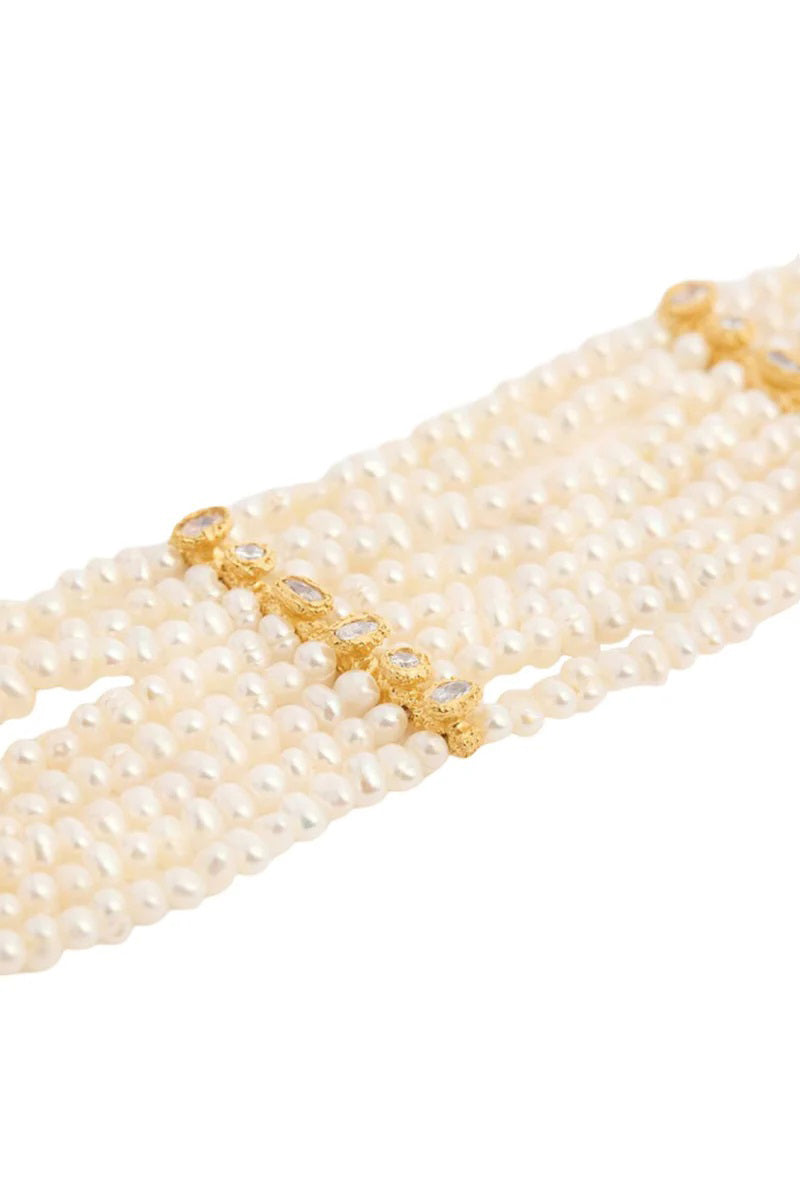 PERACAS Patmos Waves Pearl Choker necklace featuring a delicate wave design with white pearls on a sleek chain.
