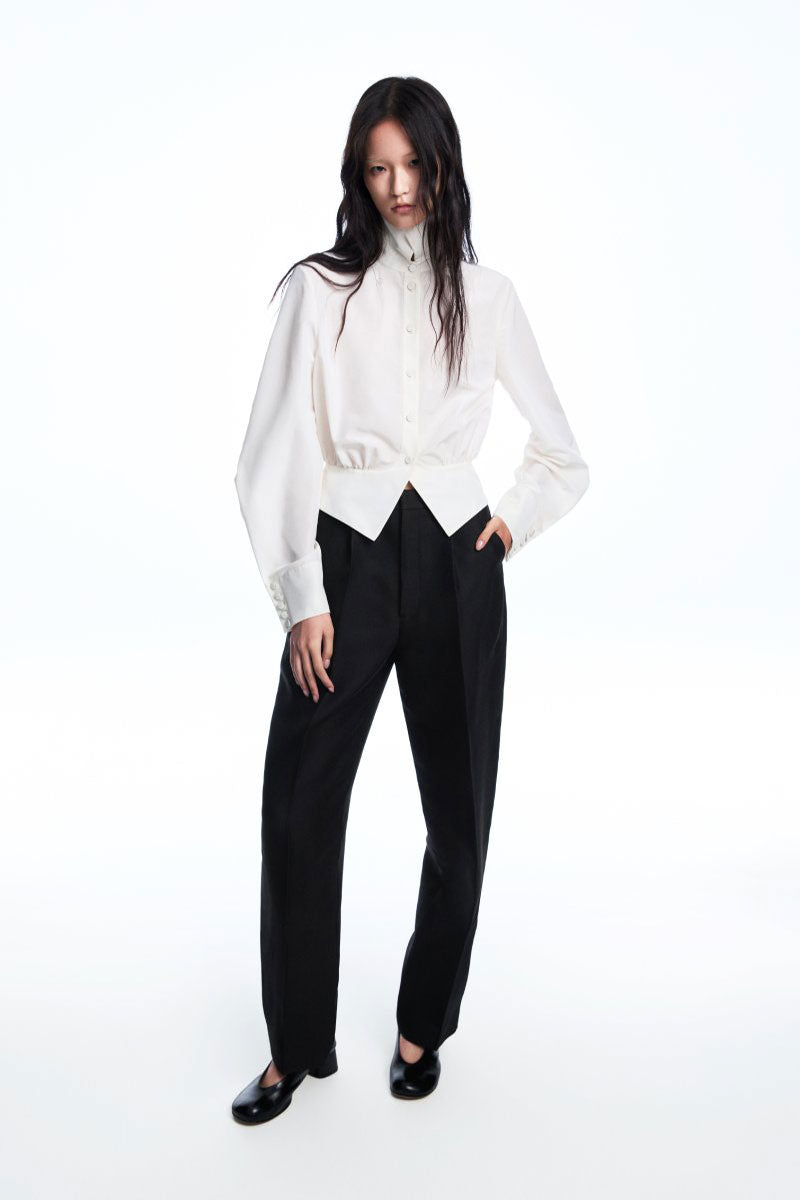 Chictopia ELODIE wide leg pleated trousers in beige fabric, featuring a high waist and flowing, relaxed fit.