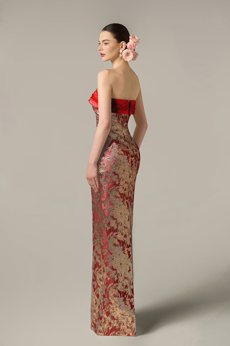 Red metallic jacquard and silk taffeta gown by I.H.F with intricate patterns and elegant draping.