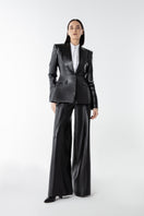 Lili Blanc vegan core trousers, stylish pants with a relaxed fit, featuring a high waist and sleek design.