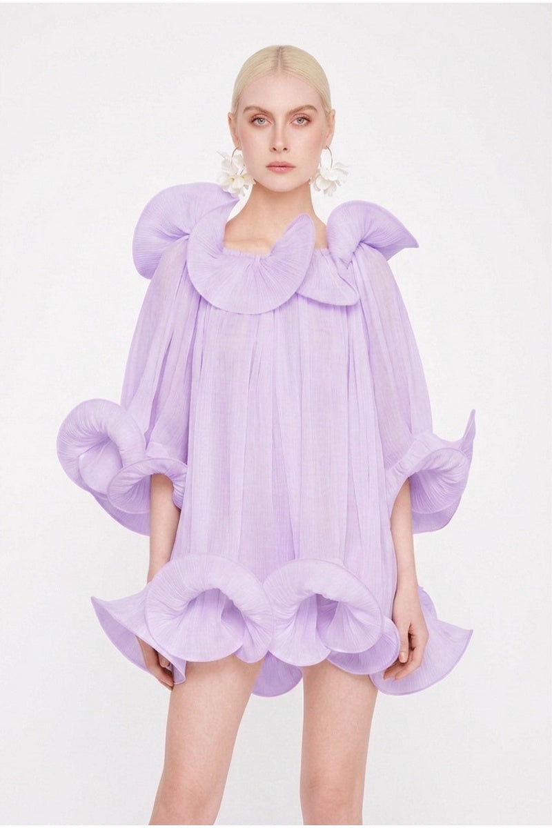 Valenciani Origami Cloud purple mini dress displayed on a mannequin with a fitted silhouette and flowy fabric.
