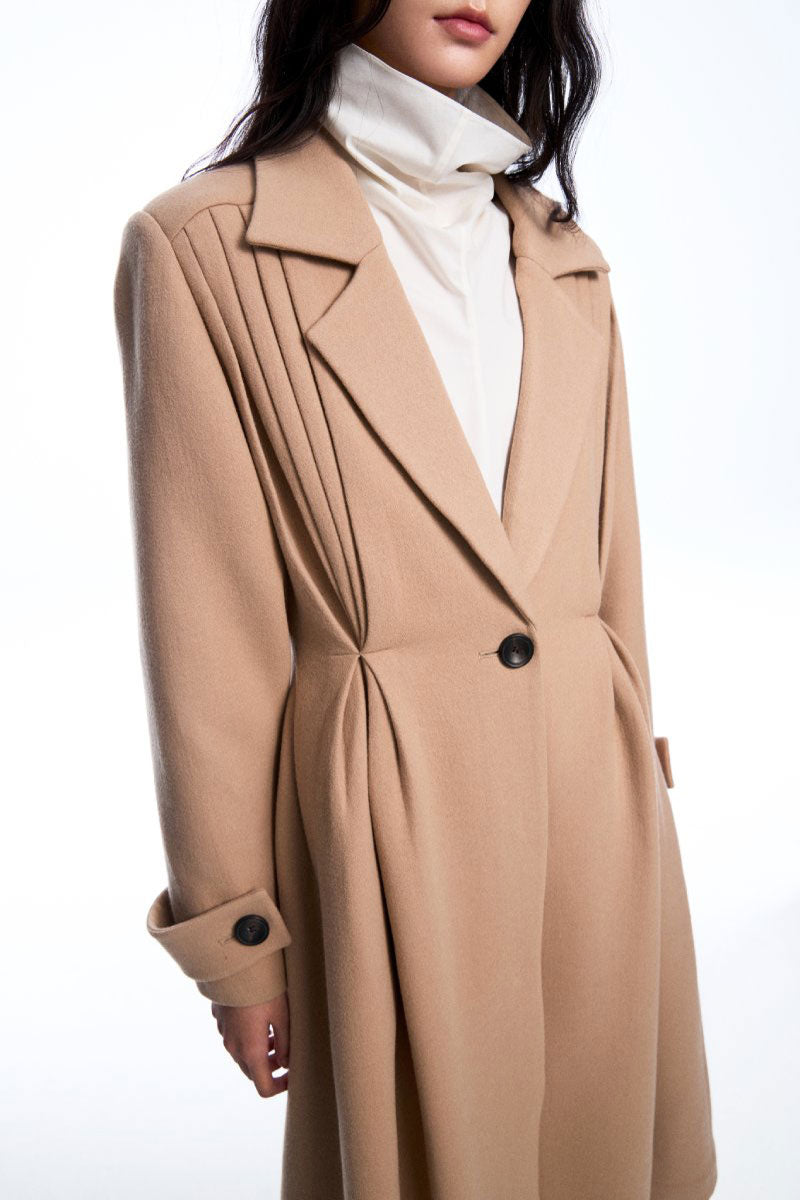 Beige pleated wool coat from Chictopia featuring a tailored fit and classic collar for a stylish winter look.