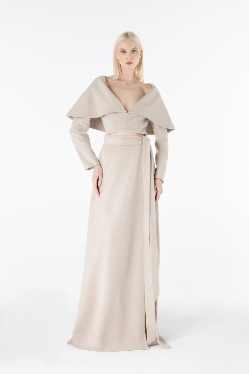 Lili Blanc cashmere wrap maxi skirt in a soft, elegant fabric with a flowing design and subtle wrap detail.