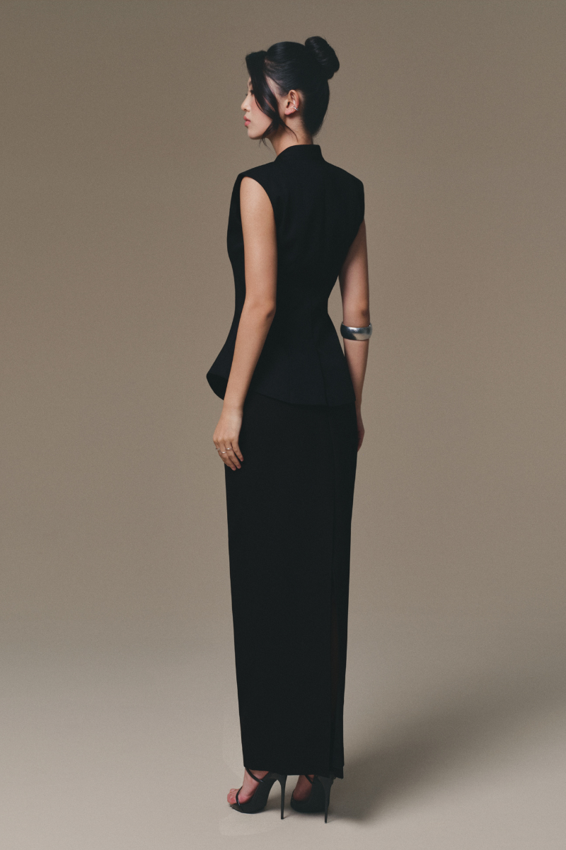 Keira Tong peplum waistcoat featuring a fitted design and stylish detailing, perfect for layered fashion looks.